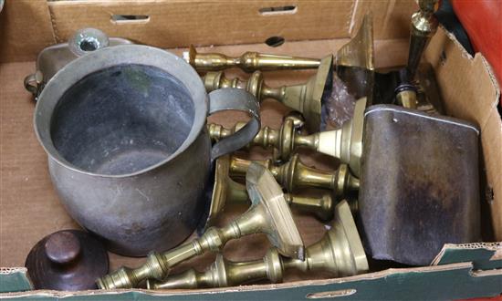 A quantity of brass candlesticks